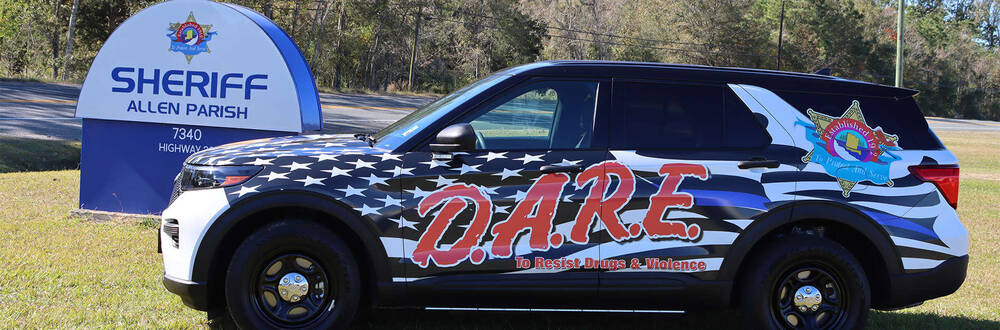 Sheriff Allen Parish car decorated with the D.A.R.E logo and design.